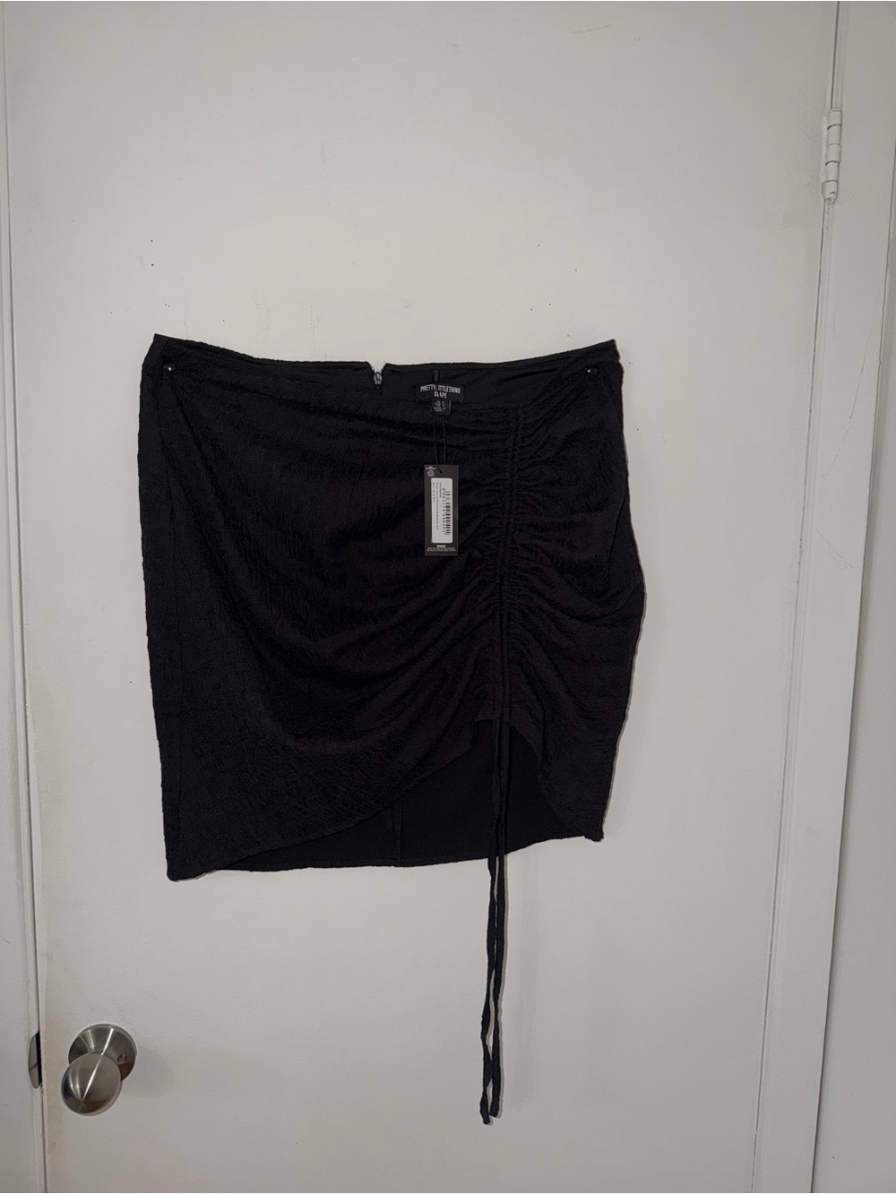 PrettyLittleThing Black Ruched Side-Tie Mini Skirt